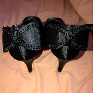 2/$25 Satin Peak toe heels with rhinestone bow on back